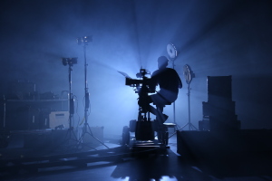 A camera set up on a jib with an operator